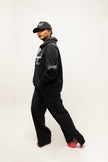 PANTALON HAUTE COUTURE EN POLYESTER IMPRIMÉ LOGO CREKMONGA PARIS, UNE FENTE